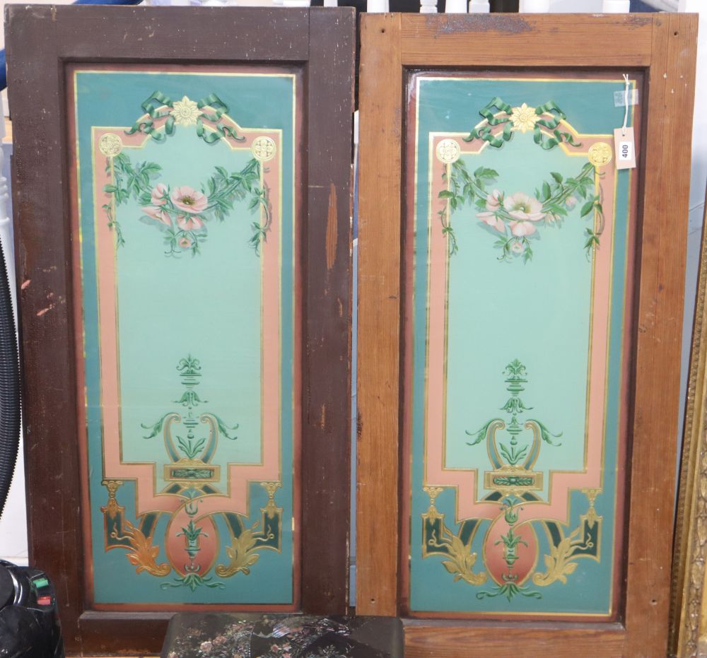 A pair of pine doors inset decorative reverse-painted and gilded glass panels with floral and foliate motifs, height 119cm width 58cm